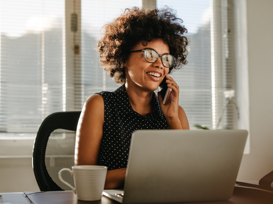 An advisor speaking on the phone in an office.